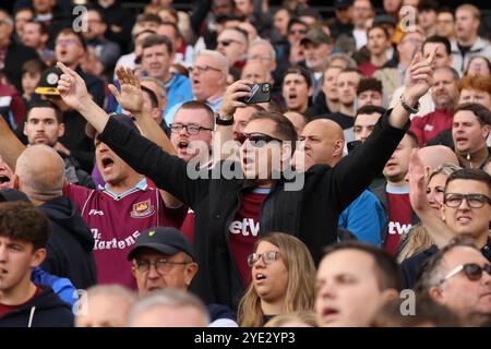 `West Ham United fans - West Ham United v Manchester United, Premier League, London Stadium, London, UK - 27th October 2024 Editorial Use Only - DataCo restrictions apply Stock Photo